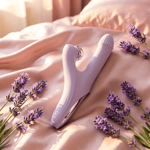 Linglong vibrator on pink silk with lavender - bedroom lifestyle